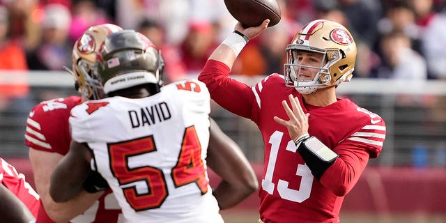 San Francisco 49ers quarterback Brock Purdy passes against Tampa Bay Buccaneers linebacker Lavonte David in Santa Clara, California, Sunday, Dec. 11, 2022.