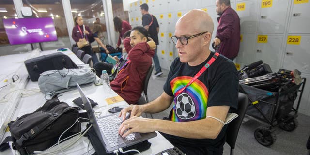 Journalist Grant Wahl works in the FIFA Media Center before a World Cup match between Wales and USMNT at Ahmad Bin Ali Stadium on Nov. 21, 2022, in Al Rayyan, Qatar.