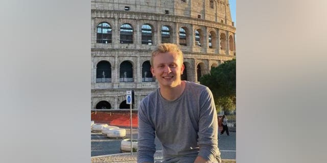 Ken DeLand seen smiling in photo while studying abroad in Europe. 