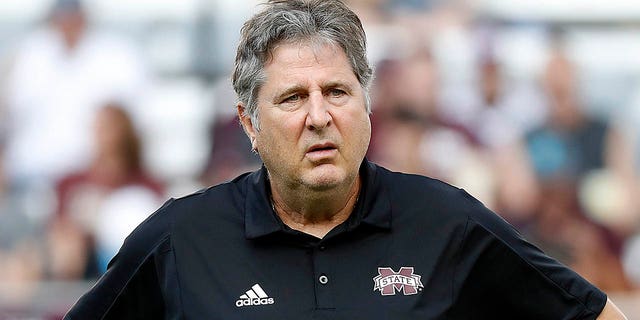 Head coach Mike Leach of the Mississippi State Bulldogs watches his players warm up before playing the Texas A and M Aggies at Kyle Field Oct. 2, 2021, in College Station, Texas.