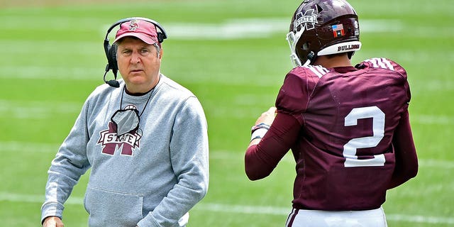 Head coach Mike Leach of the Mississippi State Bulldogs and quarterback Will Rogers speak during the first half of the Maroon and White spring game at Davis Wade Stadium April 17, 2021, in Starkville, Miss.