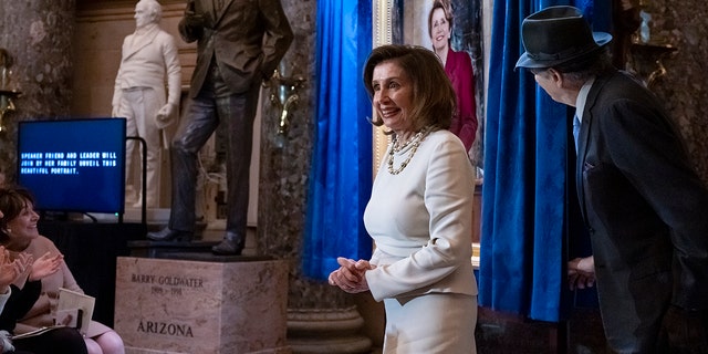 Speaker of the House Nancy Pelosi, D-Calif., is joined by her husband, Paul Pelosi, as they attend her portrait unveiling ceremony at the Capitol in Washington, D.C., on Wednesday.