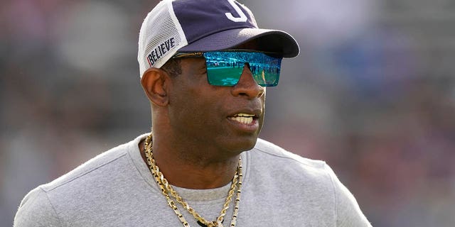 Jackson State head coach Deion Sanders watches his players prior to the Southwestern Athletic Conference championship against Southern University Dec. 3, 2022, in Jackson, Miss. 