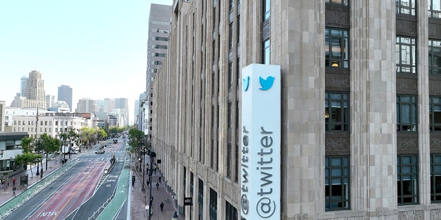 In an aerial view, a sign is seen posted on the exterior of Twitter headquarters on April 27, 2022 in San Francisco, California.