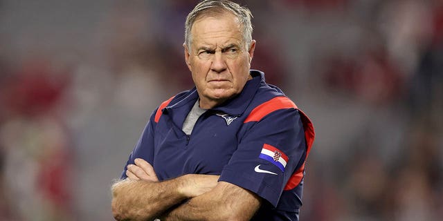 New England Patriots head coach Bill Belichick looks on prior to the game against the Arizona Cardinals at State Farm Stadium on Dec. 12, 2022 in Glendale, Arizona.