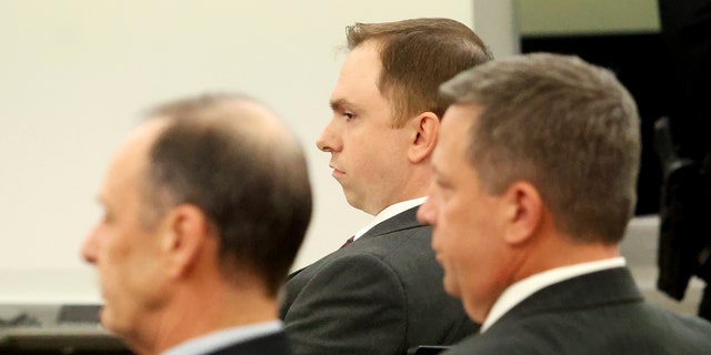 Aaron Dean, center, sits with his defense team after he was found guilty of manslaughter in the shooting death of Atatiana Jefferson, Thursday, Dec. 15, 2022, at the Tim Curry Criminal Justice Center in Fort Worth, Texas.