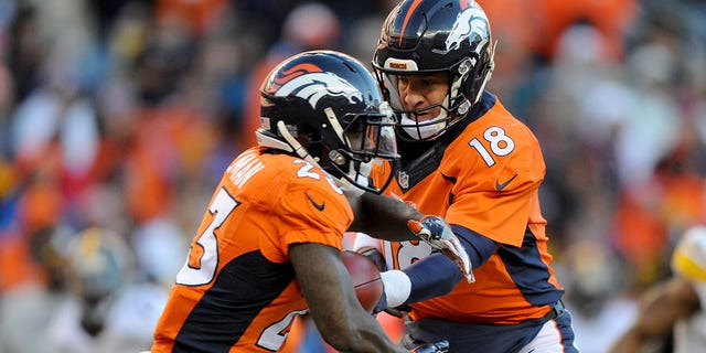 Peyton Manning #18 of the Denver Broncos hands off to Ronnie Hillman #23 of the Denver Broncos during the AFC Divisional Playoff Game against the Pittsburgh Steelers at Sports Authority Field at Mile High on January 17, 2016 in Denver, Colorado.