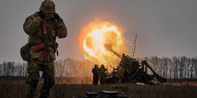 Ukrainian soldiers fire a Pion artillery system at Russian positions near Bakhmut, Donetsk region, Ukraine, Friday, Dec. 16, 2022. 