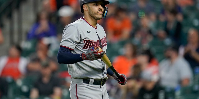 Minnesota Twins shortstop Carlos Correa heads to the dugout after striking out against the Baltimore Orioles in Baltimore on May 2, 2022.