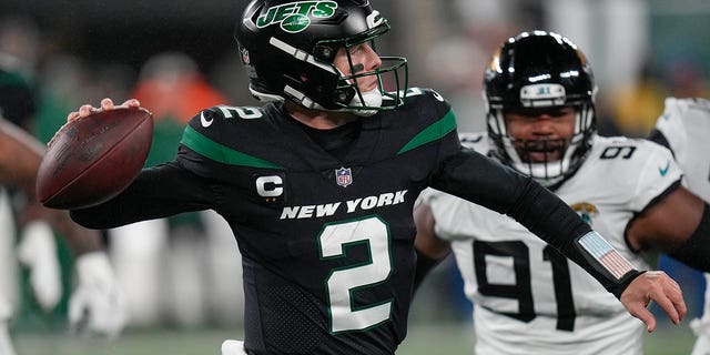 New York Jets quarterback Zach Wilson passes against the Jacksonville Jaguars, Thursday, Dec. 22, 2022, in East Rutherford, New Jersey.