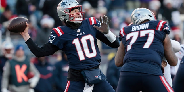 Mac Jones, #10 of the New England Patriots, attempts a pass during the third quarter against the Cincinnati Bengals at Gillette Stadium on Dec. 24, 2022 in Foxborough, Massachusetts.