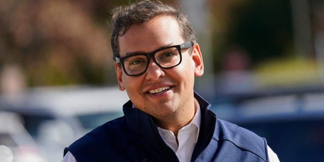 Republican candidate for New York's 3rd Congressional District George Santos campaigns outside a Stop and Shop store, Saturday, Nov. 5, 2022, in Glen Cove, New York.