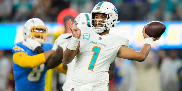 Miami Dolphins quarterback Tua Tagovailoa (1) throws during the first half of a game against the Los Angeles Chargers Dec. 11, 2022, in Inglewood, Calif. 