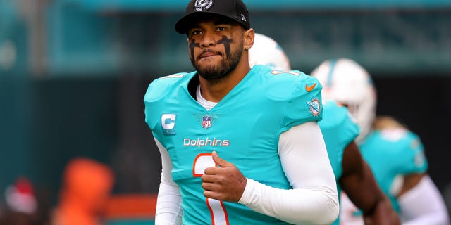 Tua Tagovailoa #1 of the Miami Dolphins takes the field prior to a game against the Green Bay Packers at Hard Rock Stadium on December 25, 2022, in Miami Gardens, Florida.