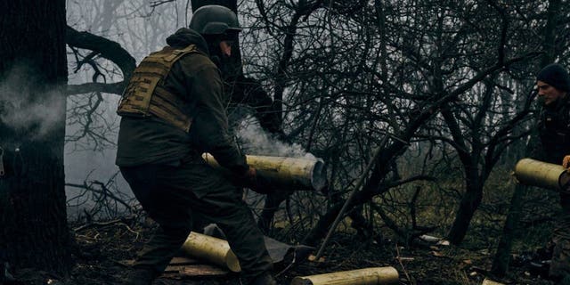 Ukrainian soldiers fire an artillery at Russian positions near Bakhmut, Donetsk region, Ukraine, Sunday, Nov. 20, 2022.