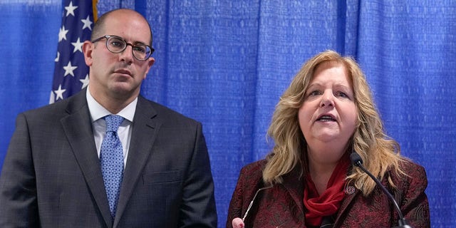 Nassau County District Attorney Anne Donnelly, right, has opened an investigation into Rep.-elect George Santos after he admitted to fabricating his résumé during his campaign.