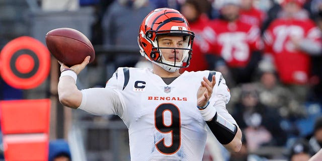 Joe Burrow of the Cincinnati Bengals attempts a pass during the second quarter against the New England Patriots at Gillette Stadium Dec. 24, 2022, in Foxborough, Mass. 