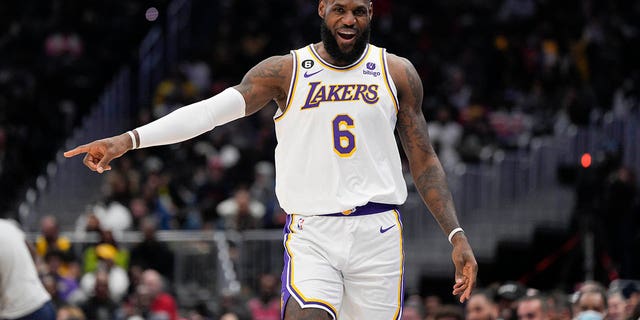 Los Angeles Lakers forward LeBron James, #6, reacts after scoring against the Washington Wizards during the first half of an NBA basketball game, Sunday, Dec. 4, 2022, in Washington, D.C.