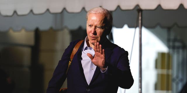 President Biden walks to speak to reporters as he and first lady Jill Biden leave the White House and walk to Marine One on the South Lawn on Dec. 27, 2022, in Washington, D.C.