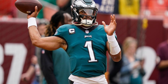 Philadelphia Eagles quarterback Jalen Hurts (1) throws the ball before the start of an NFL football game against the Washington Commanders, Sunday, Sept. 25, 2022, in Landover, Md. 