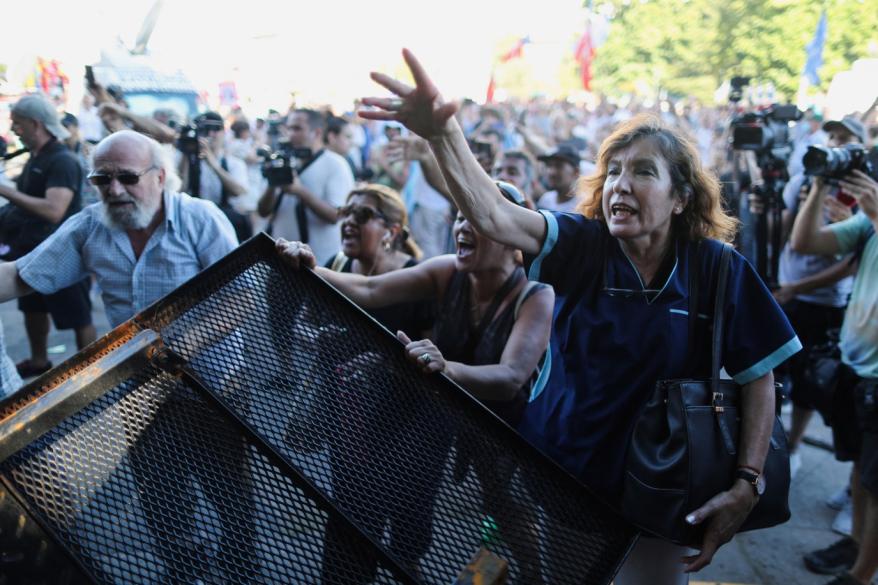 Supporters of Argentine Vice President Cristina Fernandez de Kirchner react as they protest outside the Comodoro Py courthouse in Buenos Aires, Argentina on Dec. 6, 2022.