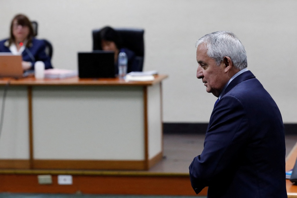 Perez Molina walks in front of the judges after his sentencing. 