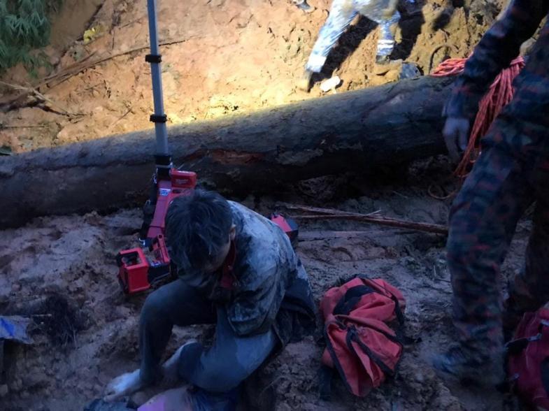 A victim rests during rescue and evacuation operations following the landslide at a campsite in Batang Kali, Selangor state, on the outskirts of Kuala Lumpur, Malaysia, on Dec. 16, 2022.