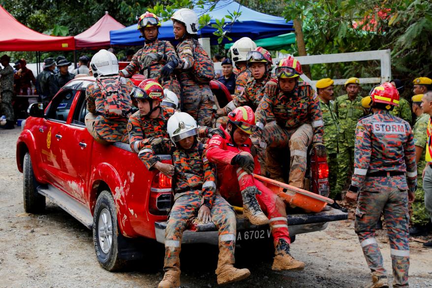 Rescue crews arrive to aid in search for victims of the landslide in Batang Kali, Selangor state, Malaysia on Dec. 16, 2022.