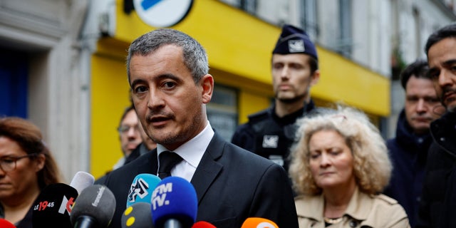 French Interior Minister Gerald Darmanin talks to journalists during a visit Rue d'Enghien after gunshots were fired killing and injuring several people in a central district of Paris Dec. 23, 2022.  