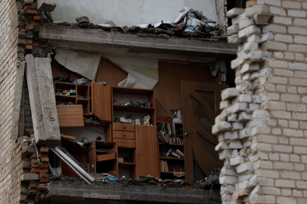 The interior of an apartment can be seen after a Russian missile strike destroyed part of a building on Christmas day.