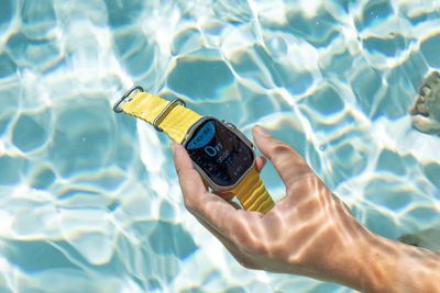 The Apple Watch Ultra under water with the Depth app pulled up