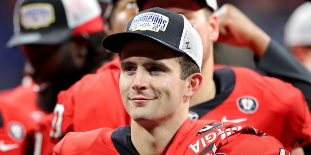 Stetson Bennett of the Georgia Bulldogs celebrates after defeating the LSU Tigers in the SEC Championship game at Mercedes-Benz Stadium on December 3, 2022, in Atlanta.