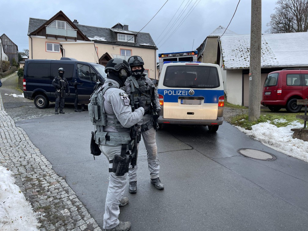 German special police forces patrol and search the area in eastern Germany on Dec. 7, 2022 during early morning raids against members of a far-right terror group.