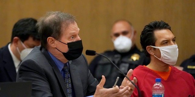 Scott Peterson, right, listens as attorney Cliff Gardner speaks during a hearing at the San Mateo County Superior Court in Redwood City, Calif., Friday, Feb. 25, 2022. (AP Photo/Jeff Chiu, Pool)