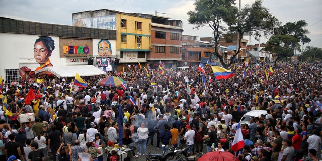 Supporters of Gustavo Petro, presidential candidate of the Historical Pact coalition, celebrate after he won a runoff presidential election in Cali, Colombia, on June 19, 2022. (AP Photo/Andres Quintero)