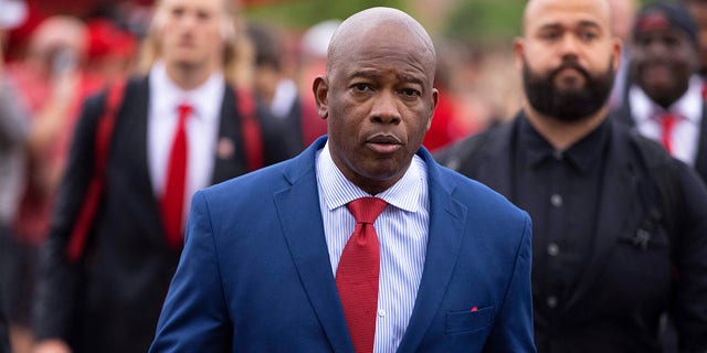 Nebraska interim head coach Mickey Joseph leads the team's unity walk across campus to Memorial Stadium before playing against Oklahoma in an NCAA college football game Saturday, Sept. 17, 2022, in Lincoln, Neb. 