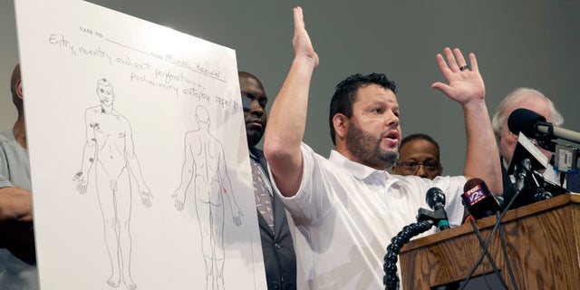 Shawn Parcells speaks during a news conference in St. Louis County, Mo., on Aug. 18, 2014. Parcells, a Kansas man who admitted running an illegal autopsy scheme, has been sentenced to nearly six years in prison for wire fraud. He was sentenced Tuesday to one year in prison on state charges, authorities said.