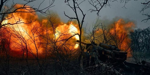 Ukrainian soldiers fire an artillery at Russian positions near Bakhmut, Donetsk region, Ukraine, Sunday, Nov. 20, 2022. 