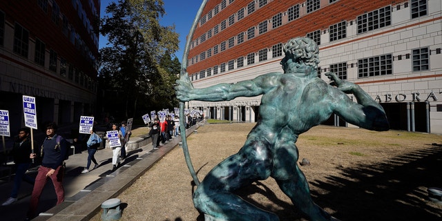 People participate in a protest outside the UCLA campus in Los Angeles, Monday, Nov. 14, 2022.