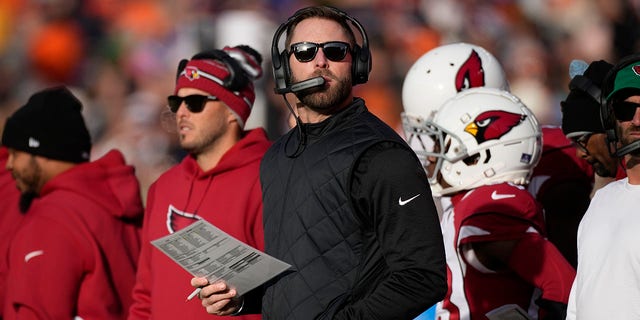 Arizona Cardinals head coach Kliff Kingsbury looks at the scoreboard during the first half of a game against the Denver Broncos Dec. 18, 2022, in Denver. 