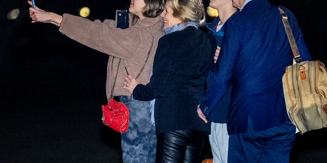 President Joe Biden, first lady Jill Biden, and their grandchildren Natalie and Robert, take a selfie before boarding Marine One on the South Lawn of the White House in Washington, Tuesday, Dec. 27, 2022, for a short trip to Andrews Air Force Base, Md., and then on to St. Croix, U.S. Virgin Islands. 