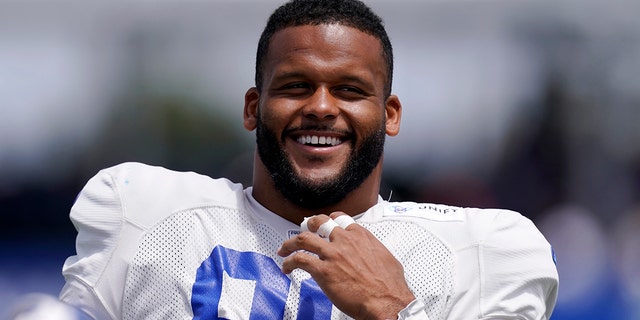 Los Angeles Rams defensive end Aaron Donald smiles at practice July 30, 2022, in Irvine, Calif. 