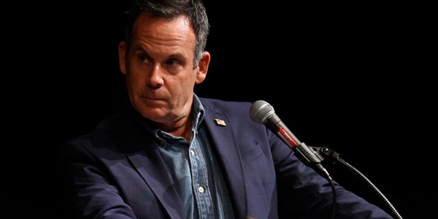 FILE: Democrat House Candidate Adam Frisch listens to incumbent U.S. Congresswoman Lauren Boebert during a debate at Colorado Mesa University as part of The Club 20 political conference on September 10, 2022, in Grand Junction, Colorado. 