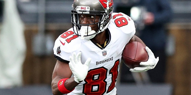 Antonio Brown of the Tampa Bay Buccaneers carries the ball against the defense of the New York Jets in the third quarter of the game at MetLife Stadium in East Rutherford, New Jersey, on Jan. 2, 2022.