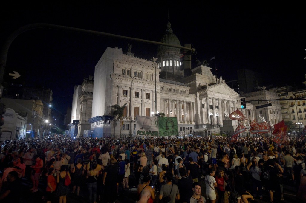 Supporters of Argentine Vice President Cristina Fernandez gather outside Congress after she was sentenced in Buenos Aires, Argentina on Dec. 6, 2022. 