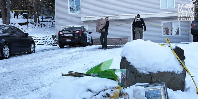 The belongings of the victims of the University of Idaho quadruple homicide are removed from the house in Moscow, Idaho, Wednesday, December 7, 2022.