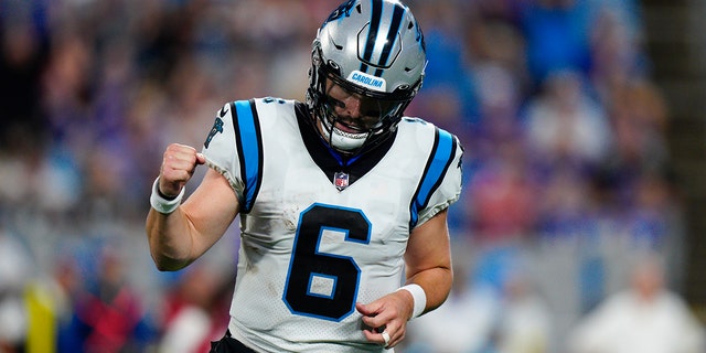 Carolina Panthers quarterback Baker Mayfield celebrates after throwing a touchdown pass against the Buffalo Bills during the first half of a preseason game Aug. 26, 2022, in Charlotte, N.C. 