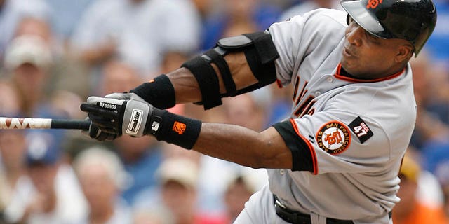 San Francisco Giants' Barry Bonds hits a single against the Chicago Cubs during the third inning of a game, July 19, 2007, in Chicago.