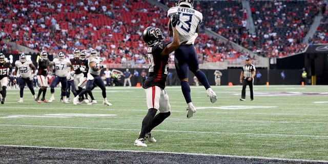 Aug 13, 2021; Atlanta, Georgia, USA; Tennessee Titans wide receiver Cameron Batson (13) makes a touchdown catch against Atlanta Falcons cornerback Chris Williamson (29) during the second quarter at Mercedes-Benz Stadium. 