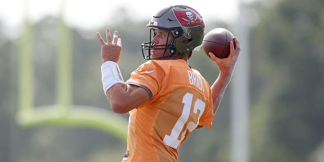 Tom Brady throws a pass during practice on Aug. 10, 2022, at the AdventHealth Training Center at One Buccaneer Place in Tampa, Florida.